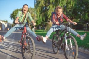 Cyclists riding side-by-side